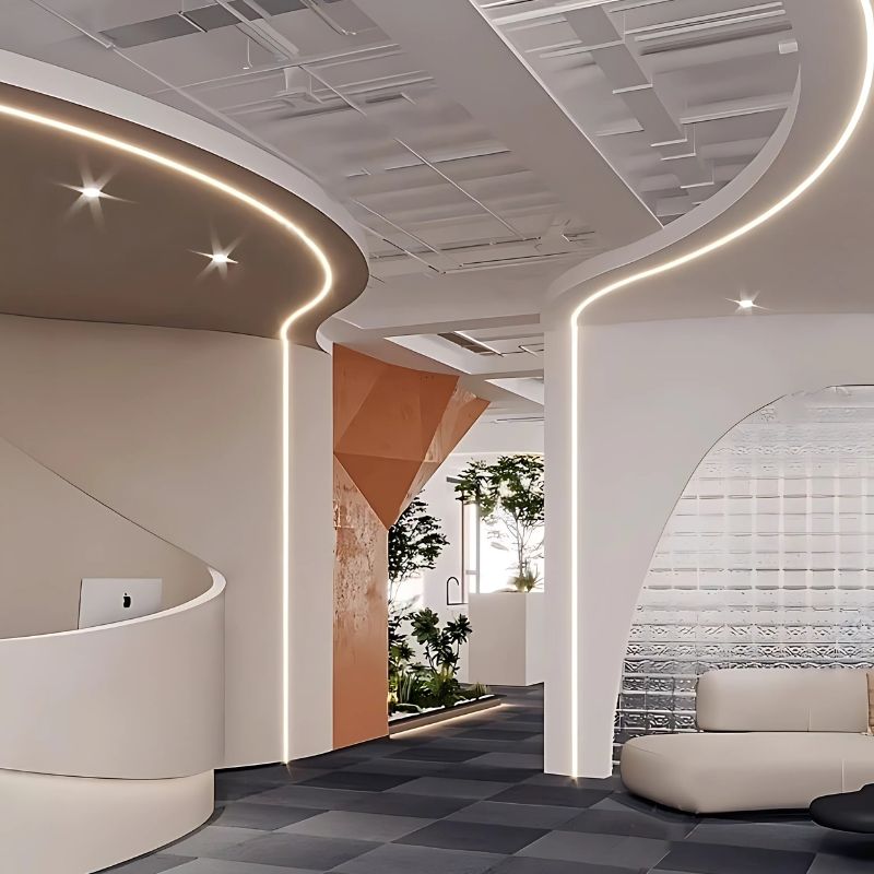 Không gian văn phòng hiện đại với quầy lễ tân, ghế sofa và đèn led hắt trần sang trọng